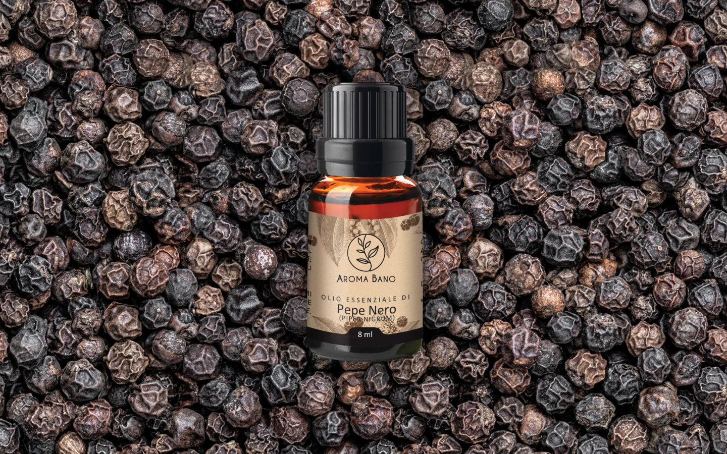 Olio essenziale di Pepe Nero con grani di pepe nero